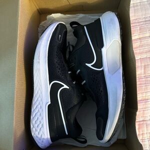 Nike women’s Black and White Sneakers